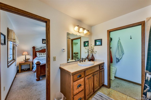 bathroom with tile floors and vanity