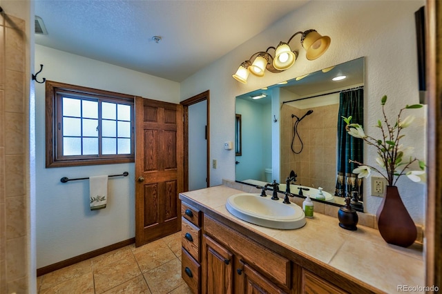 bathroom featuring tile floors and vanity