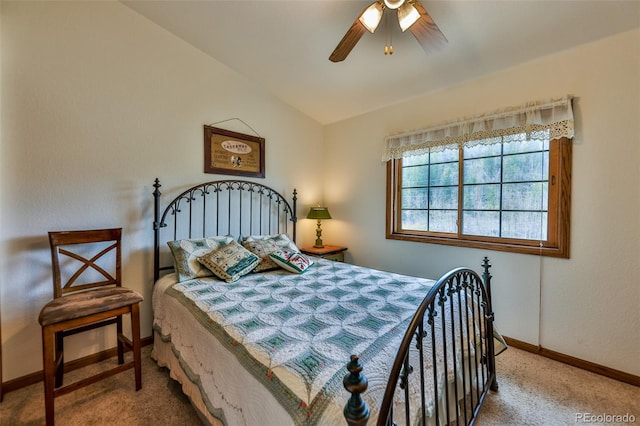 carpeted bedroom featuring ceiling fan and vaulted ceiling