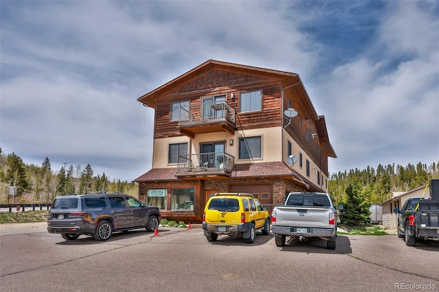 view of front of home with a balcony