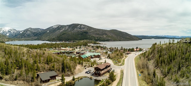 exterior space with a water and mountain view