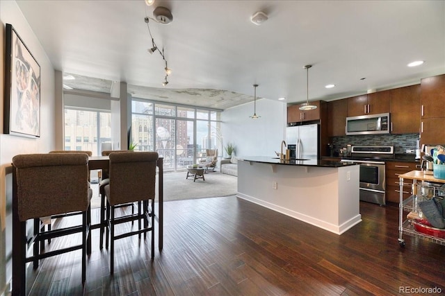 891 14th St Unit 2002, Denver, CO 80202 - dining room with dark wood-style floors and baseboards