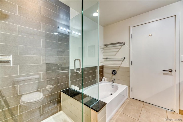 891 14th St Unit 2002, Denver, CO 80202 - full bath with a tile shower, tile patterned flooring, and a bathtub