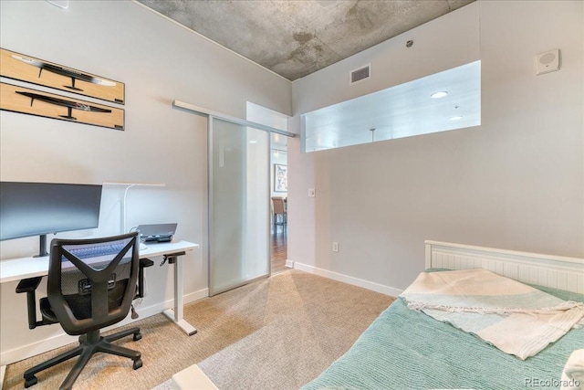 891 14th St Unit 2002, Denver, CO 80202 - bedroom with light colored carpet, a desk, and baseboards