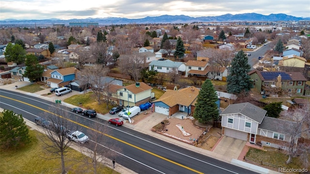 aerial view featuring a mountain view and a residential view