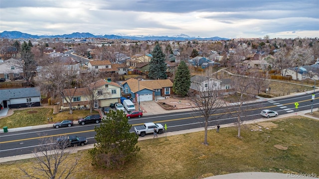 drone / aerial view featuring a residential view and a mountain view