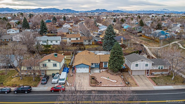 birds eye view of property featuring a mountain view and a residential view