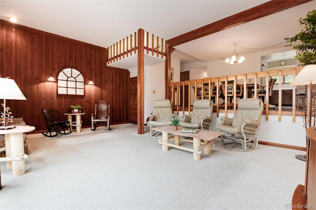 living room featuring carpet, wood walls, beam ceiling, and an inviting chandelier