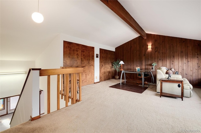 interior space featuring wooden walls, light carpet, and vaulted ceiling with beams