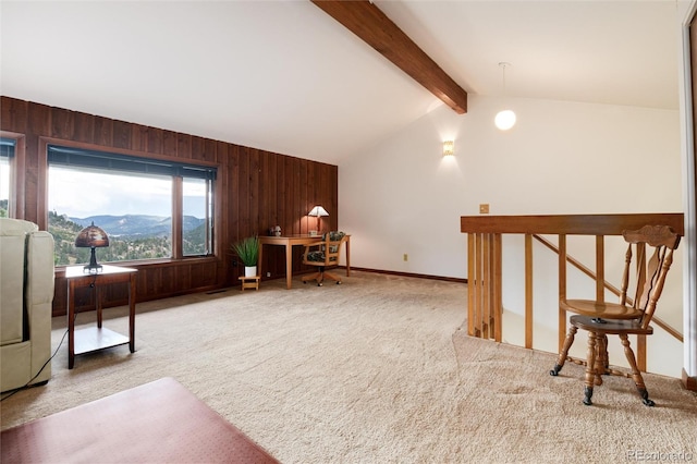 bonus room featuring wood walls, a mountain view, vaulted ceiling with beams, and light colored carpet