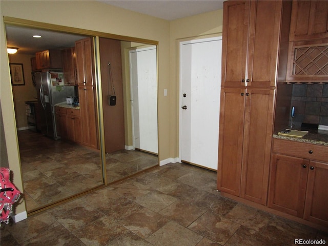 kitchen with stainless steel fridge with ice dispenser