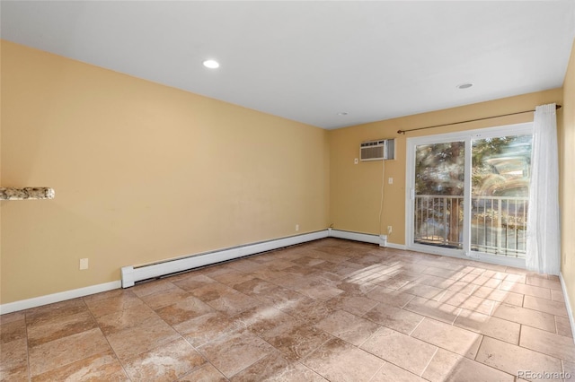 spare room featuring a baseboard heating unit and a wall unit AC