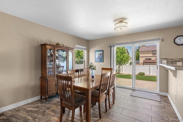 8020 Firecracker Trl, Colorado Springs, CO 80817 - dining area featuring baseboards and a textured ceiling