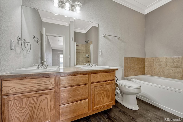 full bathroom featuring crown molding, shower with separate bathtub, toilet, vanity, and hardwood / wood-style flooring