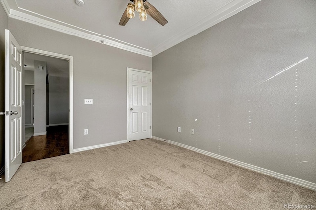 unfurnished bedroom featuring ceiling fan, carpet, and ornamental molding