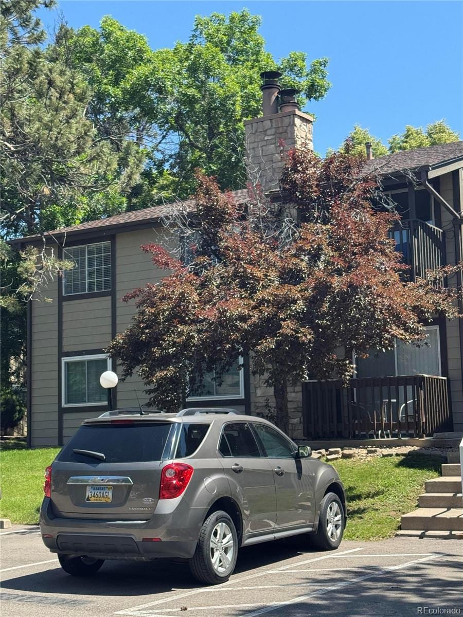1850 S Pitkin Cir Unit B, Aurora, CO 80017 - view of front of home with a chimney