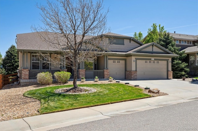 view of front of home featuring fence, brick siding, a garage, a front yard, and concrete driveway
