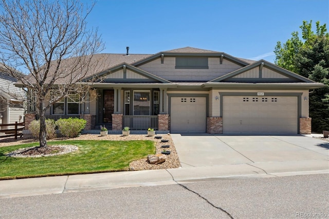 craftsman house featuring an attached garage, a porch, driveway, and brick siding