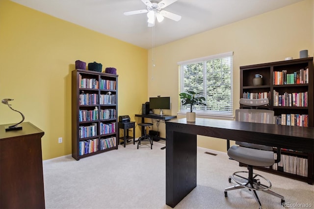 office featuring ceiling fan and carpet