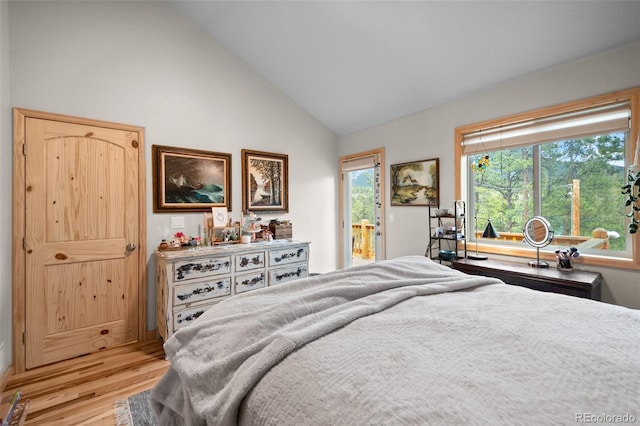 332 Harris St, Bailey, CO 80421 - bedroom featuring light wood-style flooring, access to exterior, and high vaulted ceiling