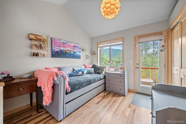 332 Harris St, Bailey, CO 80421 - bedroom with light wood-style flooring, access to outside, and lofted ceiling