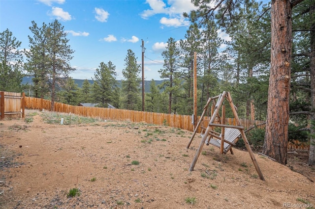332 Harris St, Bailey, CO 80421 - fenced backyard featuring a playground