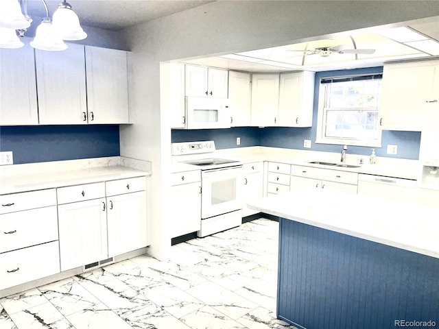 kitchen with pendant lighting, white appliances, white cabinetry, and sink