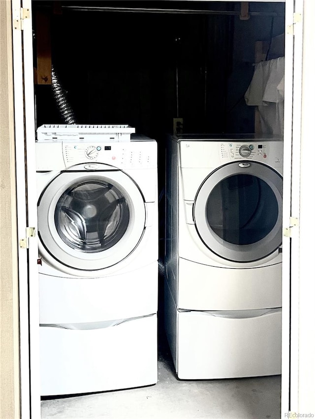 laundry room with washer and clothes dryer