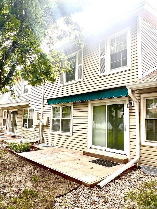 back of property featuring a patio