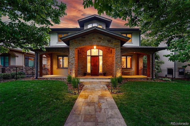 1351 S Milwaukee St, Denver, CO 80210 - view of front of home featuring stone siding, a porch, and stucco siding