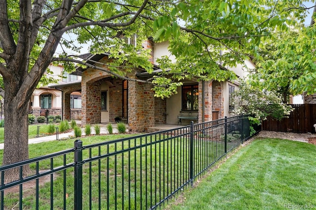 1351 S Milwaukee St, Denver, CO 80210 - view of front of house featuring stone siding, stucco siding, and a porch