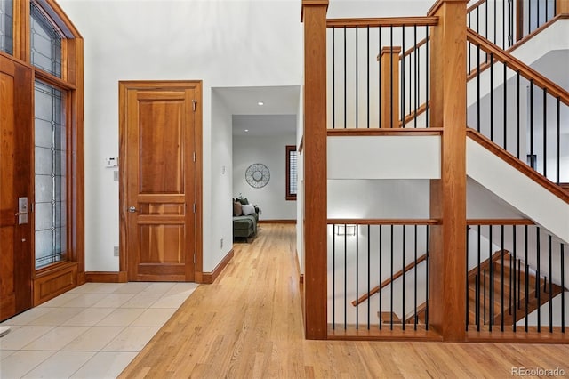 1351 S Milwaukee St, Denver, CO 80210 - foyer entrance featuring wood finished floors, stairs, baseboards, and recessed lighting