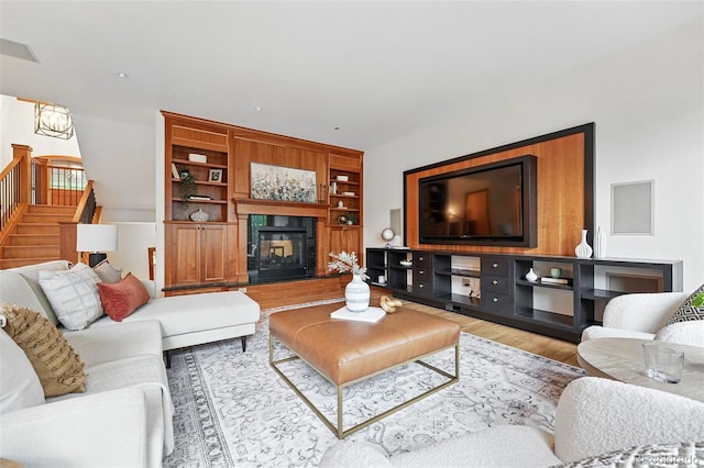 1351 S Milwaukee St, Denver, CO 80210 - living area featuring stairway, wood finished floors, and a tiled fireplace