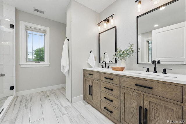 1351 S Milwaukee St, Denver, CO 80210 - bathroom with double vanity, a shower stall, and baseboards