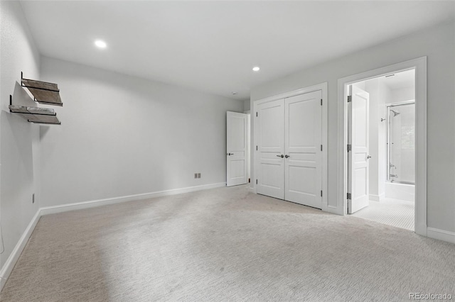 1351 S Milwaukee St, Denver, CO 80210 - unfurnished bedroom with baseboards, recessed lighting, light carpet, and ensuite bath