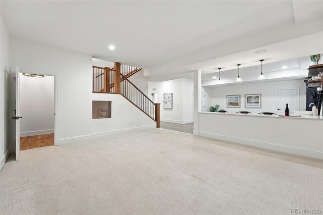 1351 S Milwaukee St, Denver, CO 80210 - unfurnished living room featuring stairs, carpet flooring, baseboards, and recessed lighting