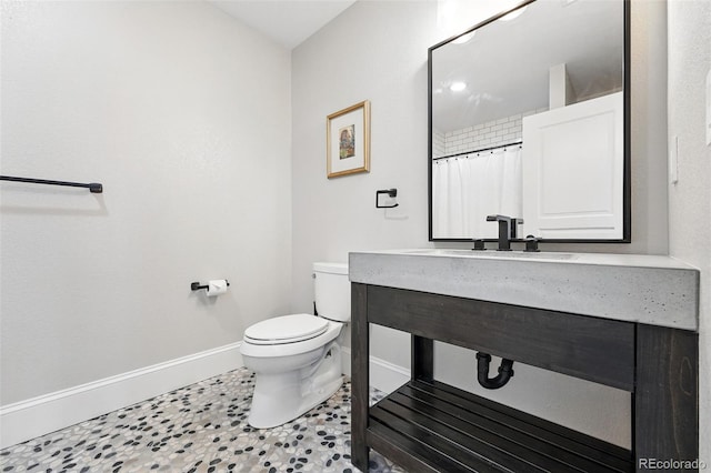 1351 S Milwaukee St, Denver, CO 80210 - full bathroom with baseboards, toilet, vanity, and a shower with curtain