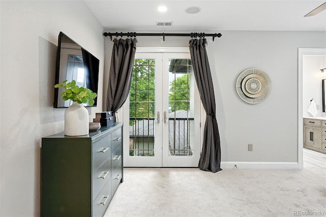 1351 S Milwaukee St, Denver, CO 80210 - entryway with french doors, light colored carpet, and baseboards