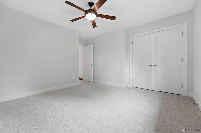 1351 S Milwaukee St, Denver, CO 80210 - unfurnished bedroom featuring light carpet, a closet, baseboards, and a ceiling fan