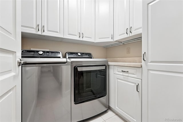 1351 S Milwaukee St, Denver, CO 80210 - laundry area featuring washer and dryer, cabinet space, and light tile patterned flooring