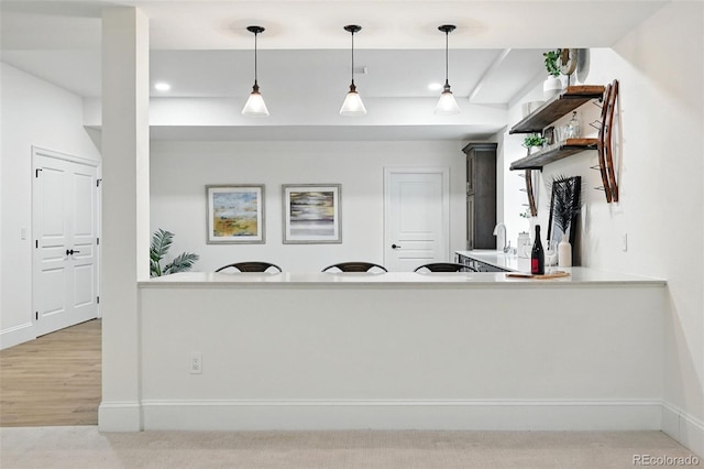 1351 S Milwaukee St, Denver, CO 80210 - kitchen featuring hanging light fixtures, baseboards, recessed lighting, and light countertops