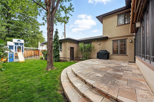 1351 S Milwaukee St, Denver, CO 80210 - view of yard featuring a patio and a playground