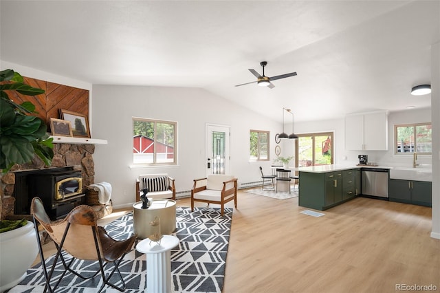 19424 Silver Ranch Rd, Conifer, CO 80433 - living room featuring light wood-style flooring, ceiling fan, lofted ceiling, and baseboard heating