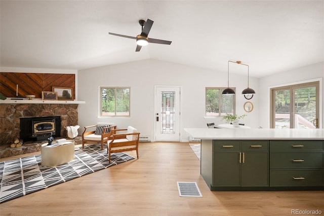 19424 Silver Ranch Rd, Conifer, CO 80433 - kitchen with green cabinets, lofted ceiling, light countertops, light wood-style flooring, and ceiling fan