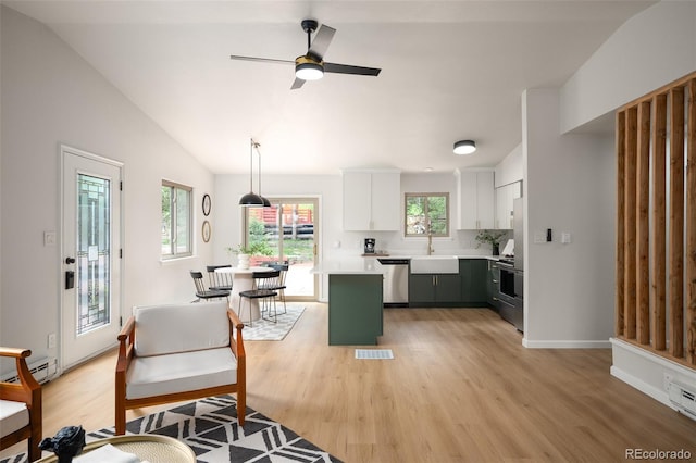 19424 Silver Ranch Rd, Conifer, CO 80433 - kitchen featuring light countertops, appliances with stainless steel finishes, a baseboard heating unit, white cabinetry, and light wood-type flooring