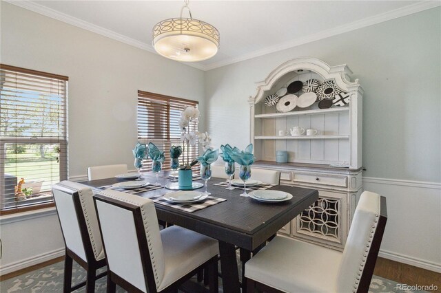 1550 Ajax St, Strasburg, CO 80136 - dining space featuring ornamental molding and dark wood-style flooring