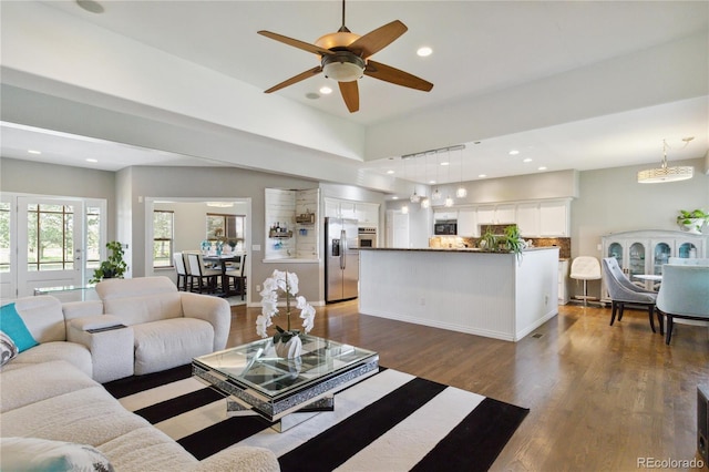 1550 Ajax St, Strasburg, CO 80136 - living area with ceiling fan, dark wood-style floors, and recessed lighting