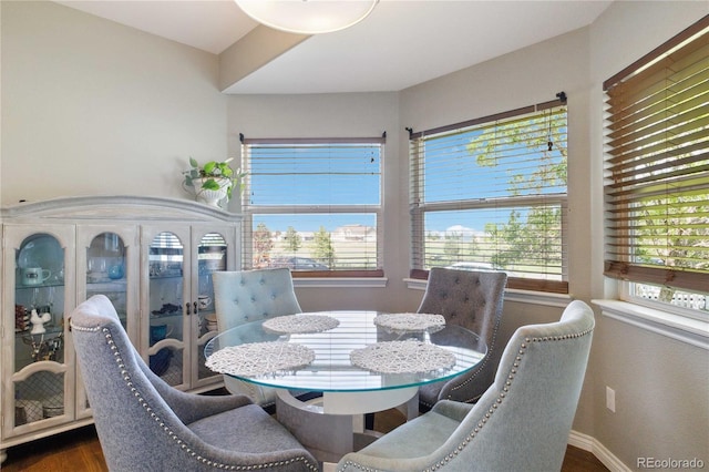 1550 Ajax St, Strasburg, CO 80136 - dining area with dark wood-style flooring and baseboards