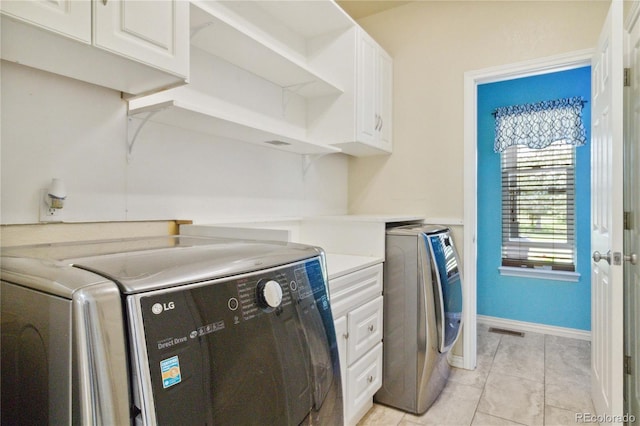 1550 Ajax St, Strasburg, CO 80136 - laundry area featuring separate washer and dryer and cabinet space