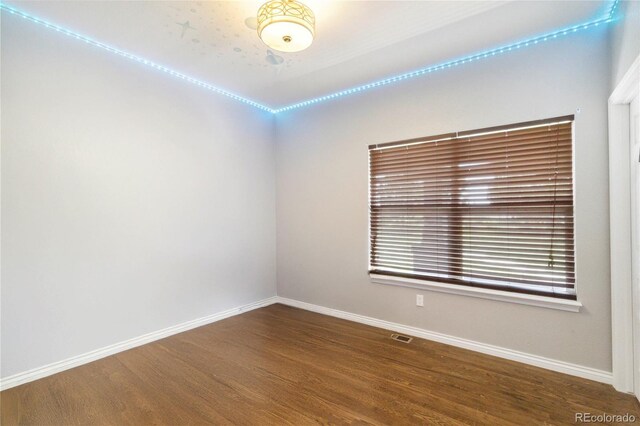 1550 Ajax St, Strasburg, CO 80136 - spare room featuring baseboards and wood finished floors